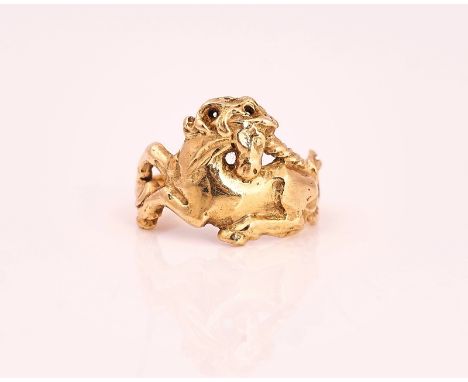 A GOLD RINGCast as a reclining unicorn, detailed indistinctly '14K',ring size M, weight 5.6gms