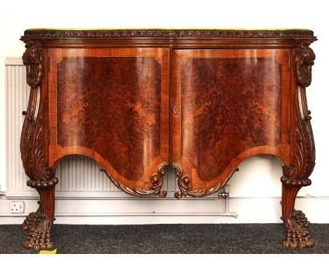 A 17TH CENTURY STYLE ITALIAN COMMODEWith faux serpentine marble top over pair of doors on elaborate paw feet, 150cm wide; 101