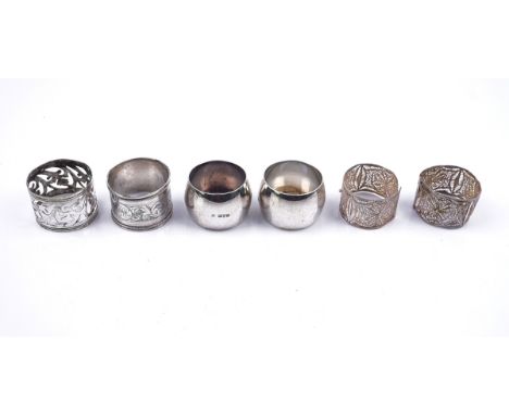 A PAIR OF SILVER NAPKIN RINGS AND FOUR FURTHER NAPKIN RINGS (6)The pair of silver napkin rings, monogram engraved, Chester 19