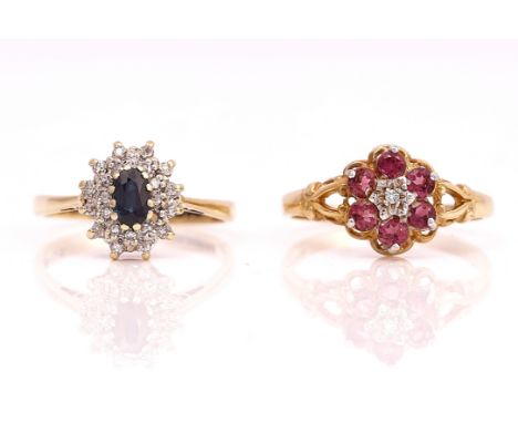 A 9CT GOLD, SAPPHIRE AND DIAMOND CLUSTER RING AND A 9CT GOLD RUBY AND DIAMOND CLUSTER RING (2)The sapphire ring, claw set wit