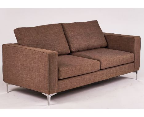 A MODERN GREY UPHOLSTERED SQUARE BACK SOFAOn polished metal supports, 195cm wide; 70cm highCondition report:&nbsp;The legs po