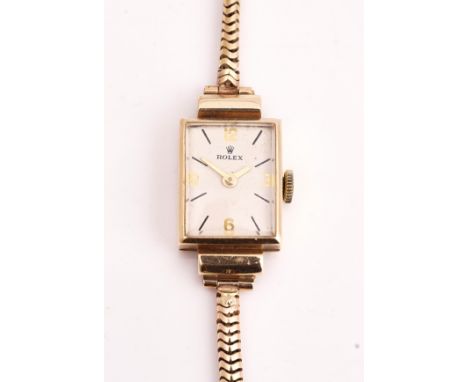A ROLEX 9CT GOLD RECTANGULAR CASED LADIES WRIST WATCHThe signed jeweled movement detailed Rolex Precision Swiss, the signed r