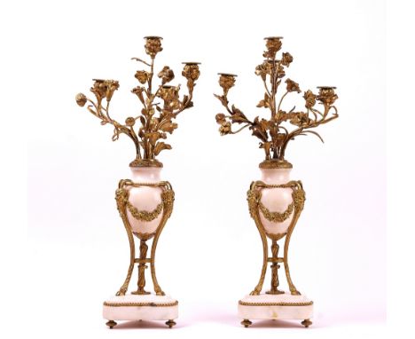 A PAIR OF FRENCH LOUIS XVI STYLE ORMOLU AND MARBLE MOUNTED FOUR-LIGHT CANDELABRA (2)Early 20th CenturyWith Satyr mask and flo