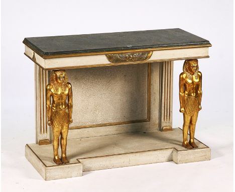 AN EGYPTIAN REVIVAL CONSOLEThe painted faux marble top on a pair of caryatid supports, 125cm wide; 89cm high; 53cm deepCondit