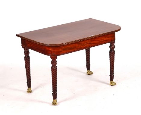 A REGENCY AND LATER MAHOGANY D-SHAPED CONSOLE TABLEOn spiral fluted supports and gilt-metal paw feet, 112cm wide; 74cm high