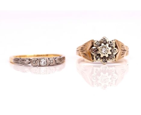 A GOLD AND DIAMOND THREE STONE RING AND A 9CT GOLD AND DIAMOND CLUSTER RING (2)The gold and platinum diamond set three stone 