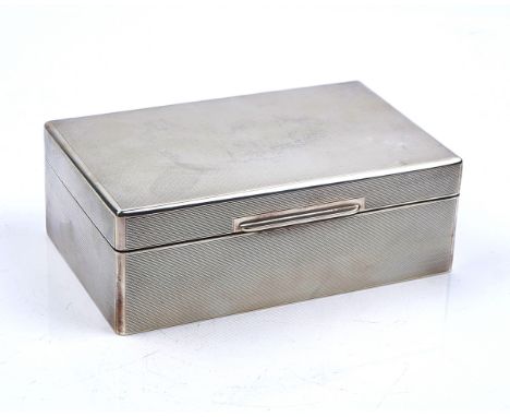 A SILVER TABLE CIGARETTE BOXOf rectangular form, wooden lined within, presentation inscribed, the exterior engine turned, Bir