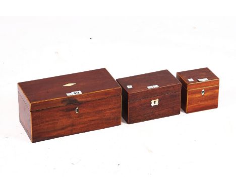 AN INLAID GEORGE III MAHOGANY RECTANGULAR TEA CADDYWith twin lidded interior, 31cm wide; 15cm high, together with two smaller