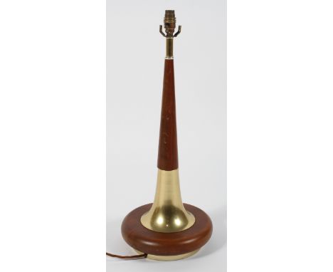A large 1960's vintage teak and brass lamp base, having a round base with tapering upright, 67cm high