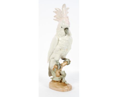 A Royal Dux Czech ceramic cockatoo, on a naturalistic base, marked to underside, 38cm high