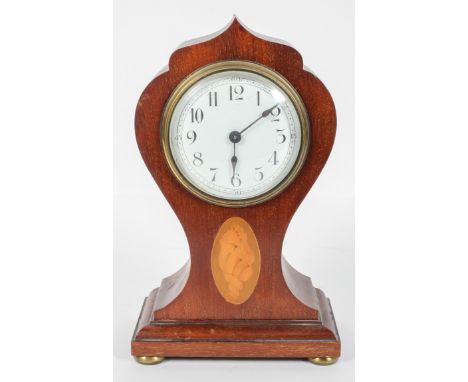An Edwardian mahogany and inlaid mantel clock, the white painted dial on a Japy Freres brass movement, in an Art nouveau styl