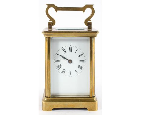 A brass carriage clock, the enamel dial with Roman Numerals denoting hours, 11.5cm high