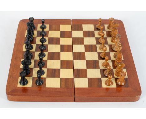 A Jacques Staunton style weighted part chess set, boxwood and ebonised, some stamped with a crown, height of king 9cm, with s