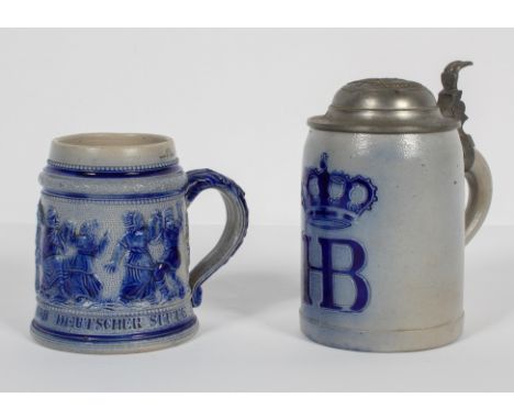 Two German salt glaze stoneware tankards, late 19th century, the first moulded with Terrier type figures and a verse, inscrib