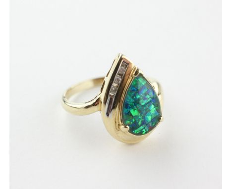 A yellow metal ring set with a synthetic mosaic opal triplet and finished with three diamonds. No hallmarks - tests indicate 