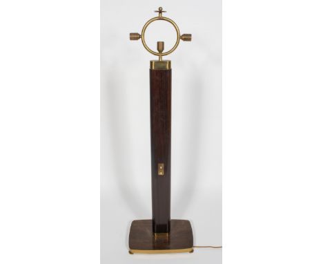 A 1950's Art Deco style floor standing lamp with an oval column, twin switch, rectangular foot and halo of brass lamp holes, 