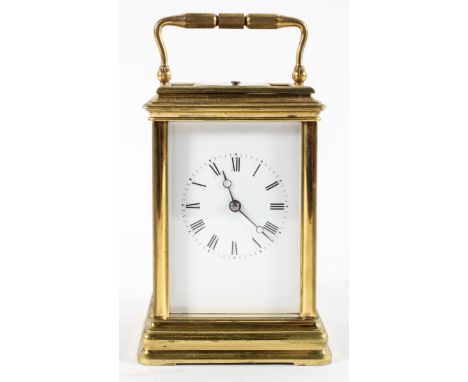 A 19th century French brass cased repeating carriage clock with eight day movement, the enamel dial with Roman numerals denot
