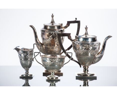 LATE VICTORIAN SILVER FOUR PIECE TEA SERVICE
maker George Nathan & Ridley Hayes, Chester 1900, each of tapering form with squ