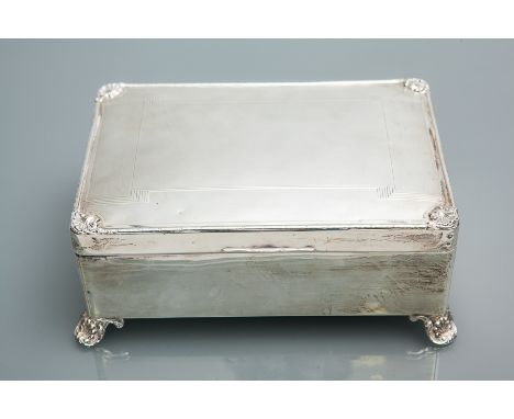 SILVER CIGAR BOX
all marks rubbed, of rectangular form, engine turned design with threaded rim, corner shell motifs and shell