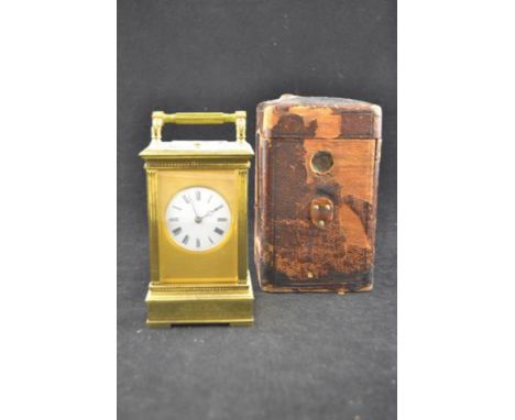 A late Victorian brass cased repeater carriage clock in leather travelling case CONDITION REPORT: repeater working but time p