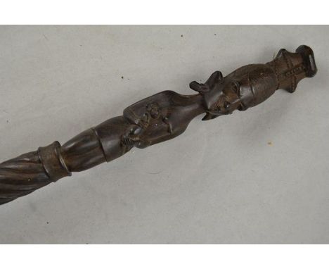 An early 20th century Kenyan hardwood spiral carved walking stick, the handle carved as female figure with baby - L80cm CONDI