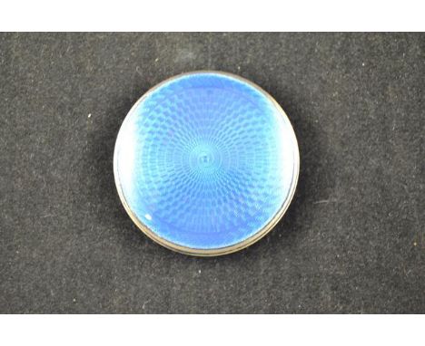 A silver circular compact with blue guilloche enamel lid, Birmingham 1929 - diam 5cm CONDITION REPORT: slight scratching to e