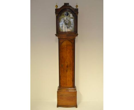 A mid 18th century walnut longcase clock, arched top with columns to sides, silvered and brass dial with rocking 'Tempust fug