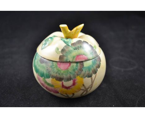A Clarice Cliff apple shaped preserve pot and cover in the Rhodanthe Aurea pattern, marked Clarice Cliff, Wilkinson England t