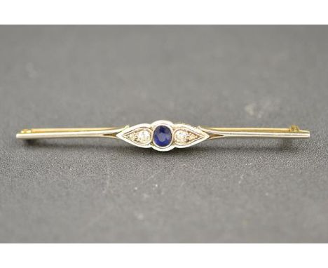 An 18ct gold bar brooch set with central sapphire flanked by four diamonds, marked M&D - length 7.3cm CONDITION REPORT: good 