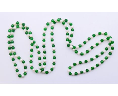 A string of jade and pearls.  120 cm long.