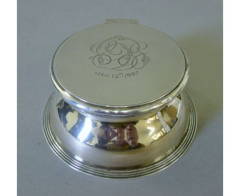 A silver-clad glass inkwell. 11 cm diameter.
