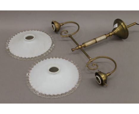 A brass twin branch hanging light. 30 cm high.