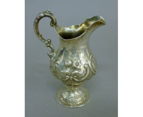 A large Victorian silver cream jug. 15 cm high. 5.3 troy ounces.