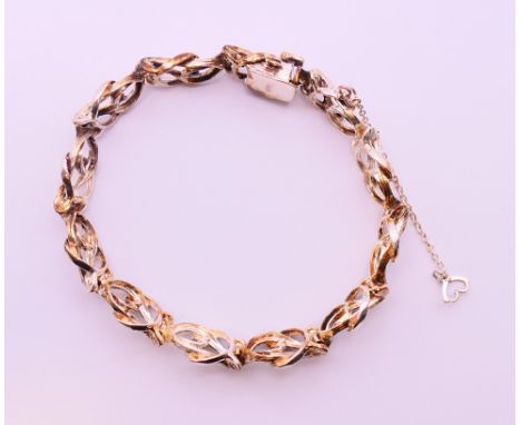 A silver bracelet.  21 cm long. 