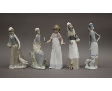 Two Lladro figurines and three Nao figurines. The largest 27 cm high.