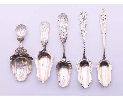 Five assorted continental silver caddy spoons.  Largest 13 cm long. 51.3 grammes. 