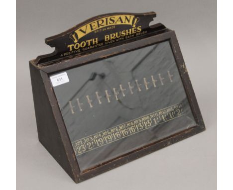 A vintage shop's advertising cabinet for Verisan toothbrushes. 35 cm wide.