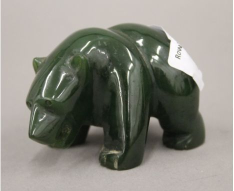 A jade model of a bear. 7 cm long.
