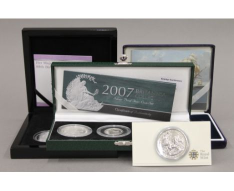 A quantity of various boxed silver proof coins.