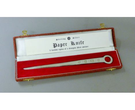 A boxed silver paper knife formed as a Georgian meat skewer. 21 cm long. 55.6 grammes.