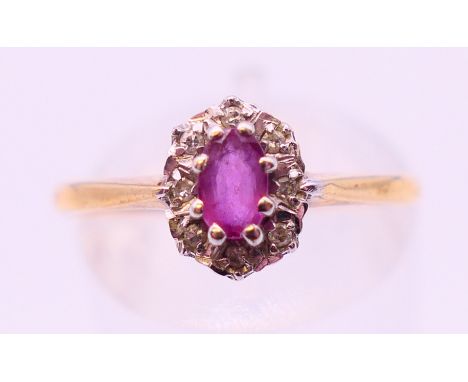 A 9 ct gold diamond and ruby ring. Ring size P.