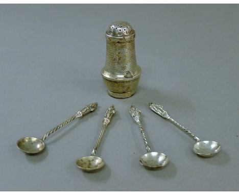 A silver pepper and four silver Apostle salt spoons. The former 6 cm high. 60 grammes.