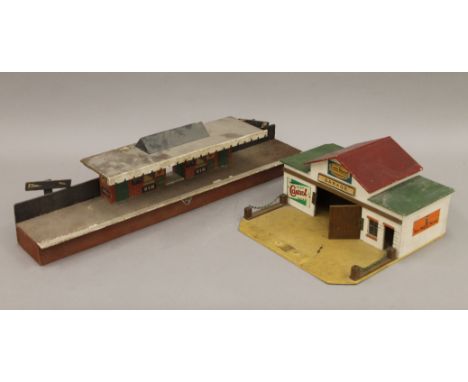 A vintage model railway station and a garage. The former 56 cm long.