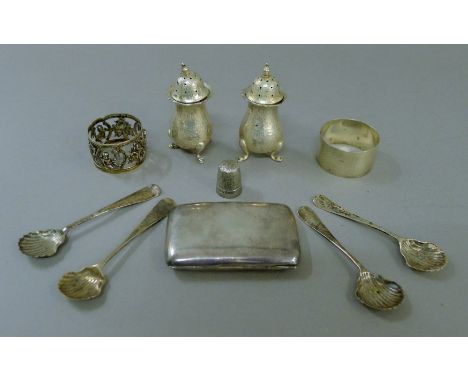 A quantity of various silver including cruets, napkin rings etc. 172.8 grammes. The cigarette case 7.5 cm long.