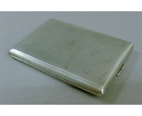 A WWII German engine-turned silver cigarette case stamped 925 S F and engraved to the interior Dr E Hofius Kriegsjahr 1939-40