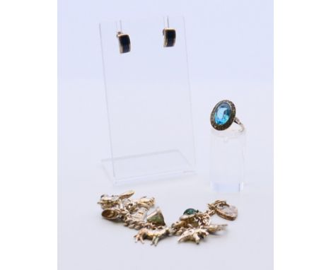 A collection of silver jewellery, to include a charm bracelet, a ring and a pair of earrings.  Bracelet 11.5 cm long.