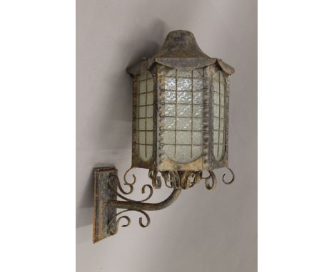 A wrought iron hanging lantern. 55 cm high.