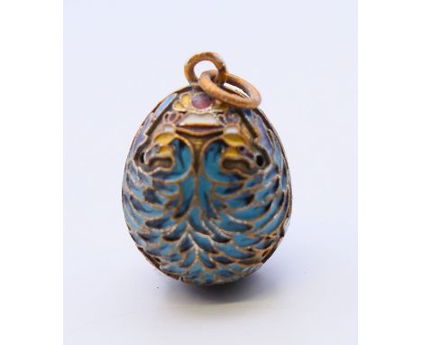 A silver and enamel egg pendant bearing Russian marks.  2.5 cm high. 