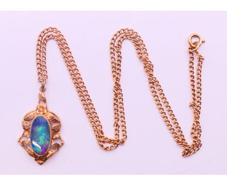 A 9 ct gold and opal pendant on chain.  Pendant 3 cm high, chain 48 cm long. 8.4 grammes total weight.  