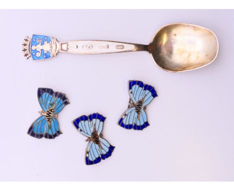 A David Andersen silver and enamel Oslo spoon, and three silver and enamel butterfly brooches. Spoon 12 cm long, brooches eac